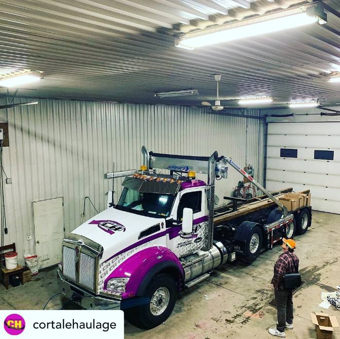 Large wrapped transport truck in the shop