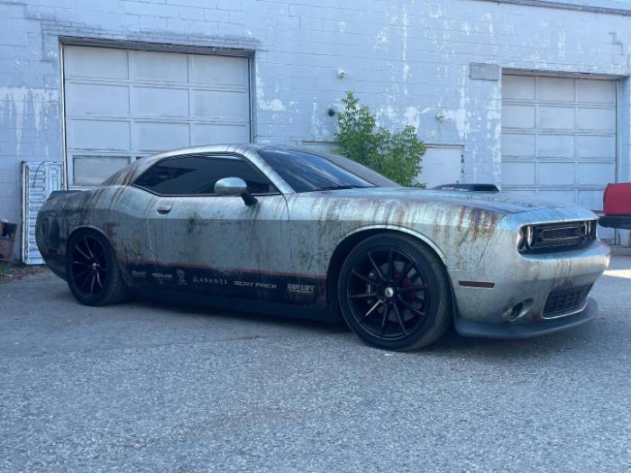 Personal car with rusted gray wrap design
