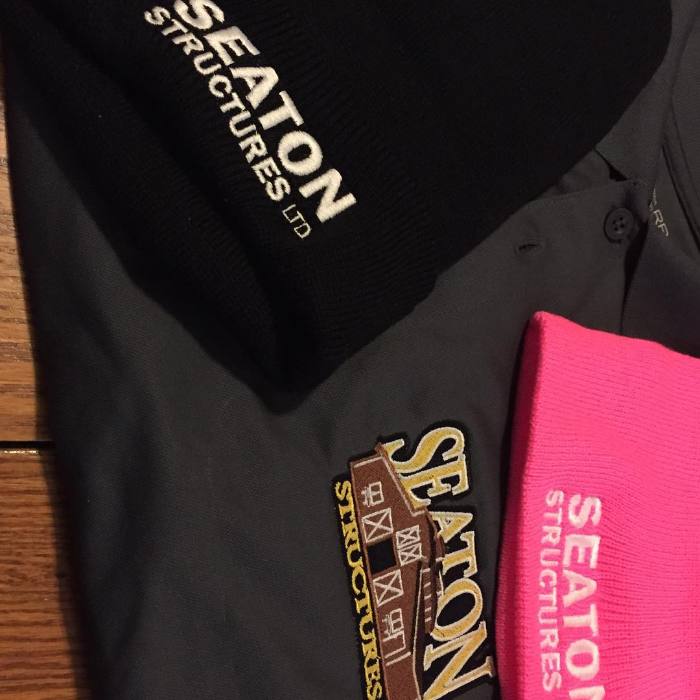 Branded sweaters and toques